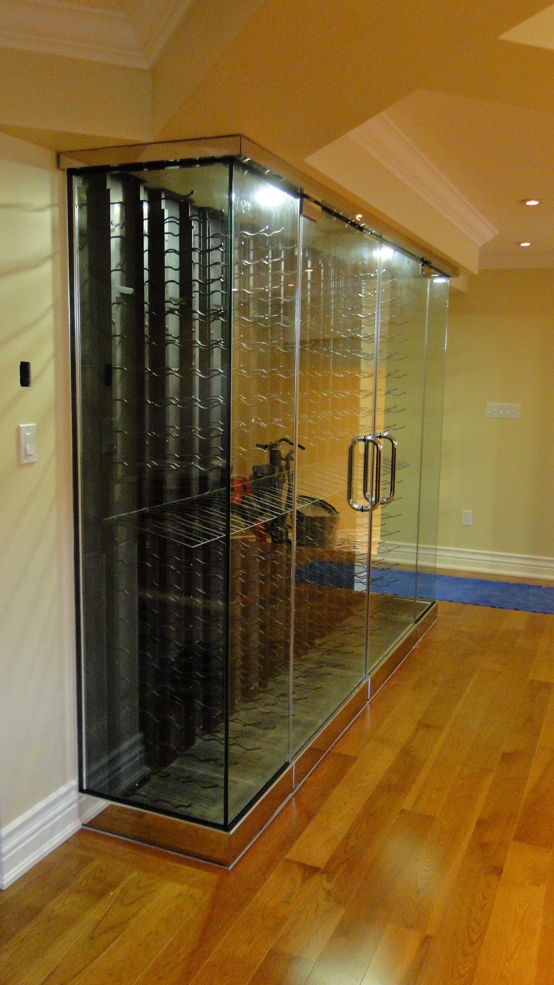VV platinum racking system. Features custom glass enclosure and hidden cooling system.