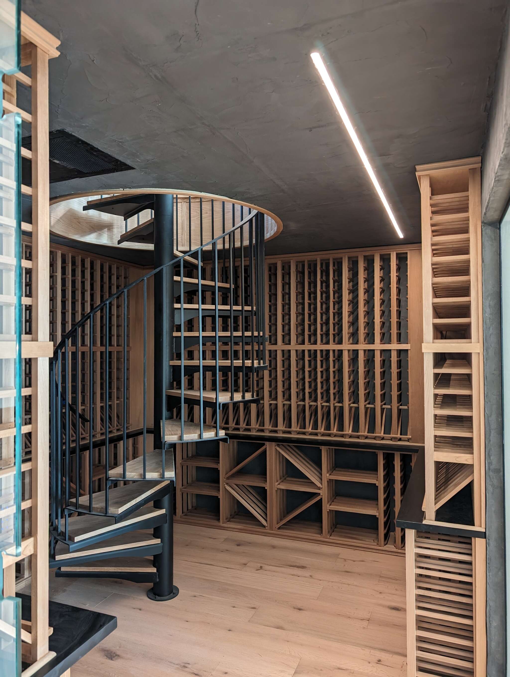 Featuring dual level wine room with spiral staircase.