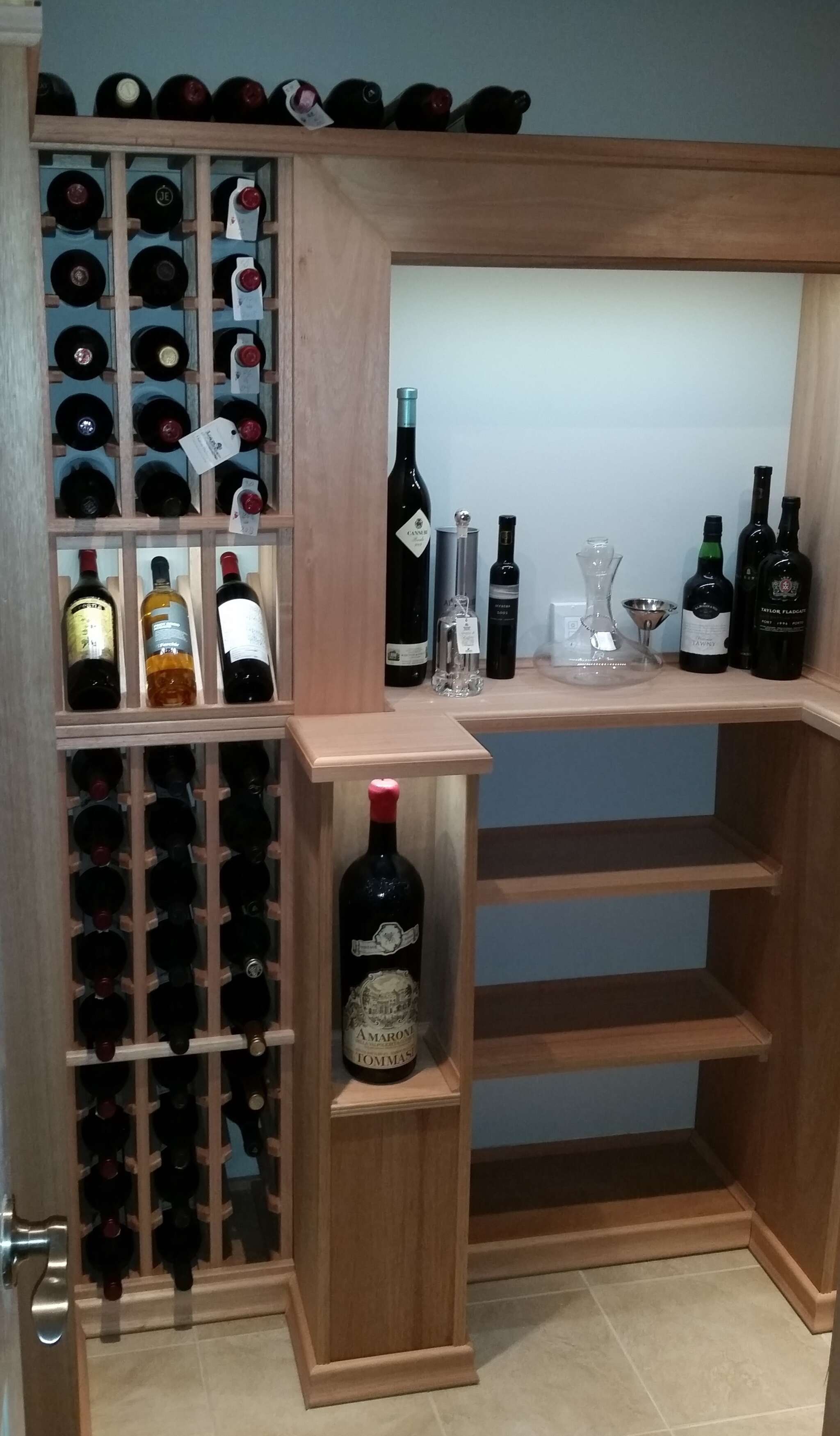 VWC custom racking system. Features LED highlights,"Jeroboam" bottle displays and plumbing concealment.