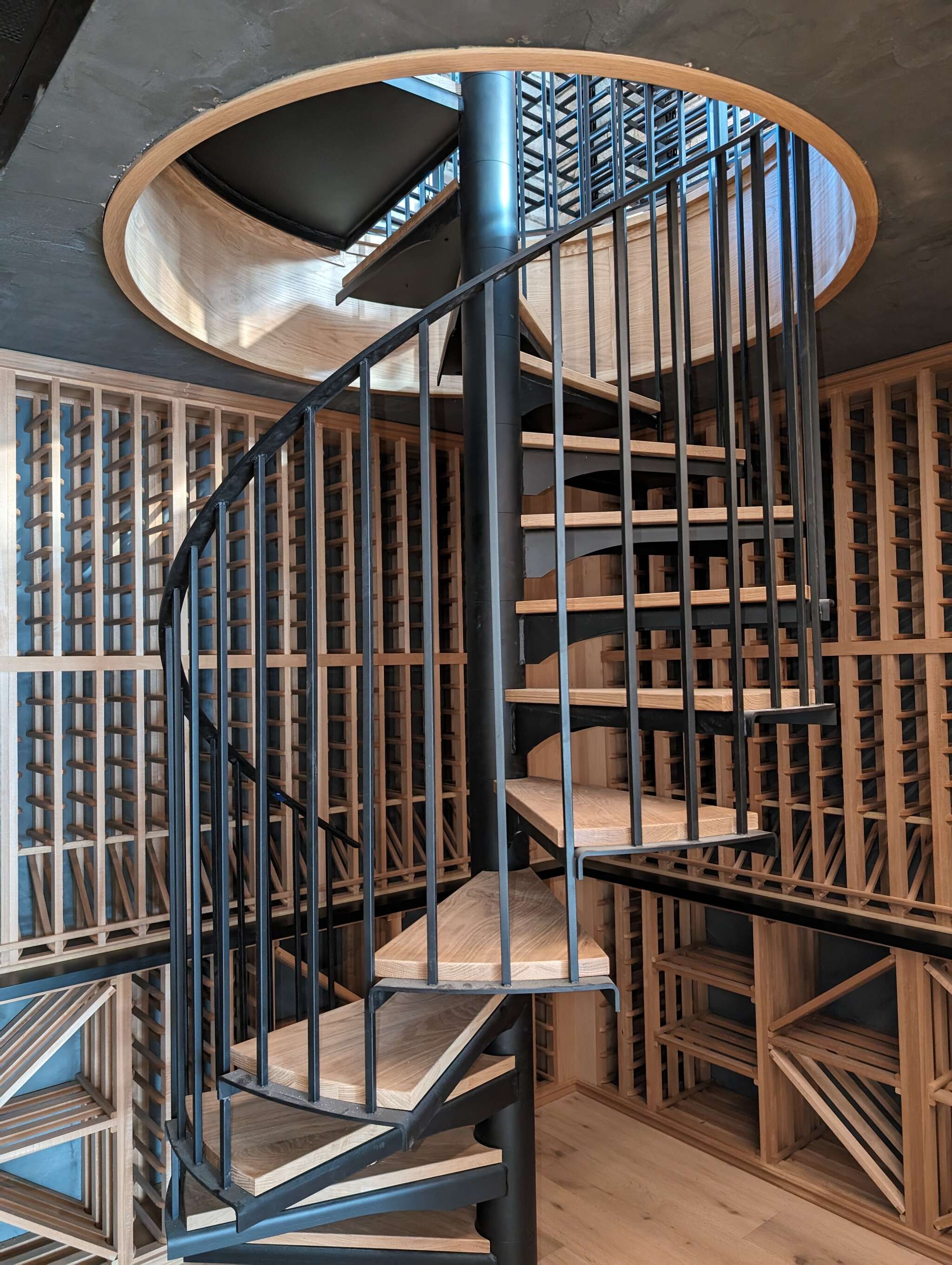 Featuring dual level wine room with spiral staircase.