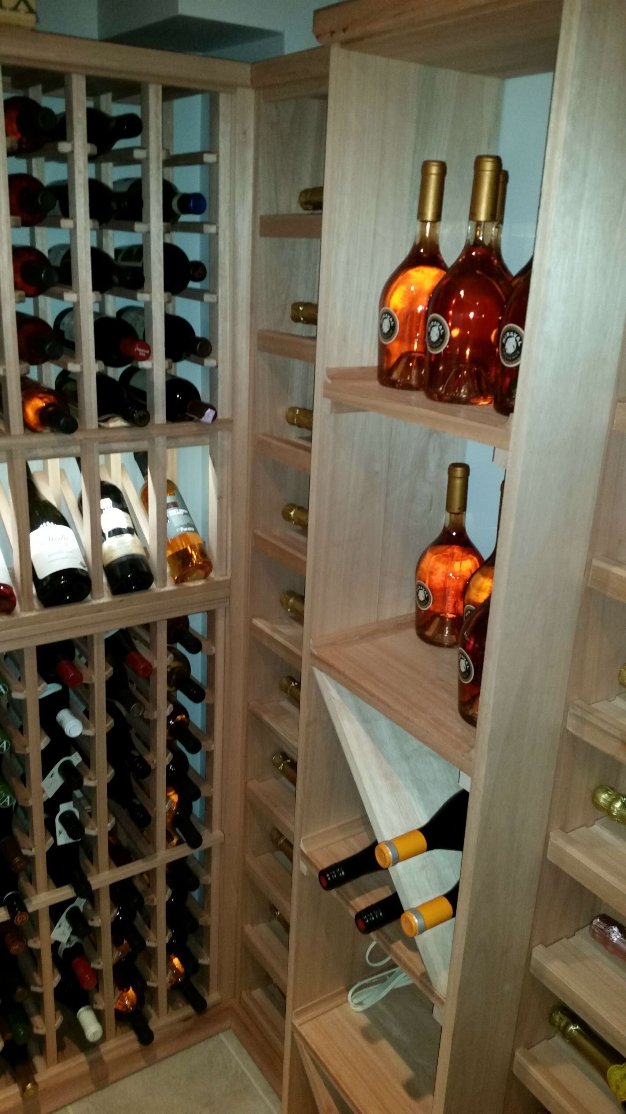 VWM custom racking system. Champagne displays with feature lighting.