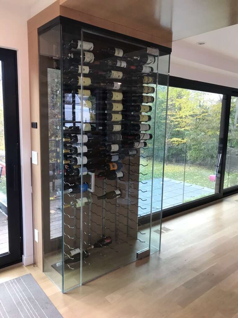 Wine cabinet featuring custom gravity cooling system.